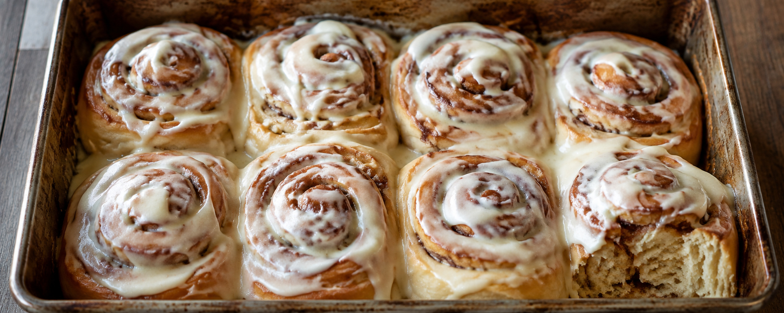 Warm cinnamon rolls with irregular vanilla glaze